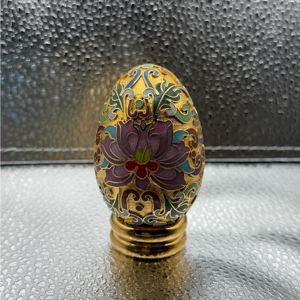 Beautiful gold egg with lotus flowers detailing colorful